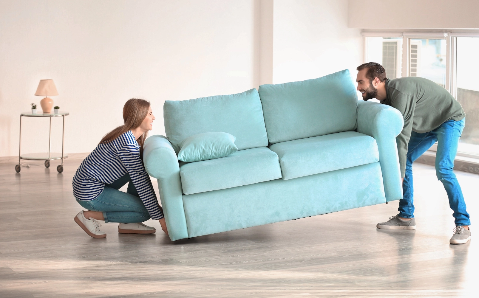 Couple moving sofa | Legend Flooring